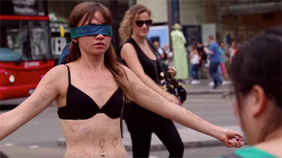 Girl Undresses in Public for Courageous Cause