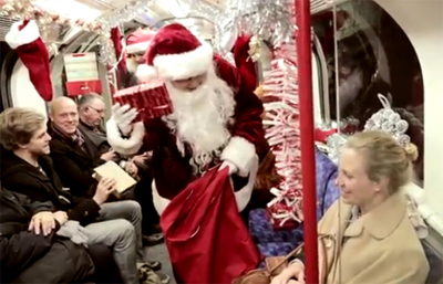 Desperate Santa tries to bring Christmas cheer to the tube