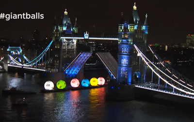 Giant National Lottery Balls sail down the River Thames