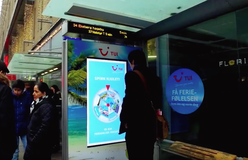Interactive wheel of fortune bus shelter for TUI