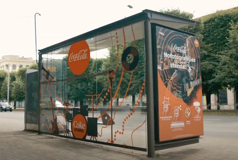 Coca-Cola photo printer at a bus shelter in Riga
